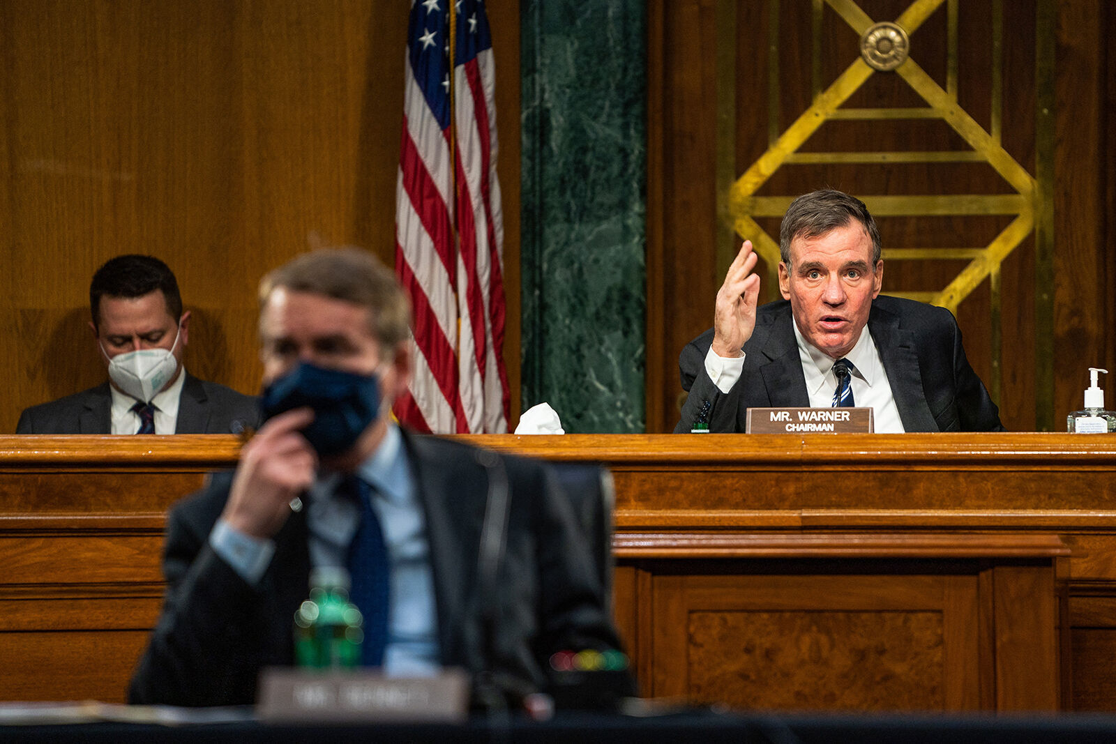 Mark Warner gives an opening statement during the Senate Intelligence Committee hearing on Capitol Hill in Washington, DC, USA, February 23, 2021.